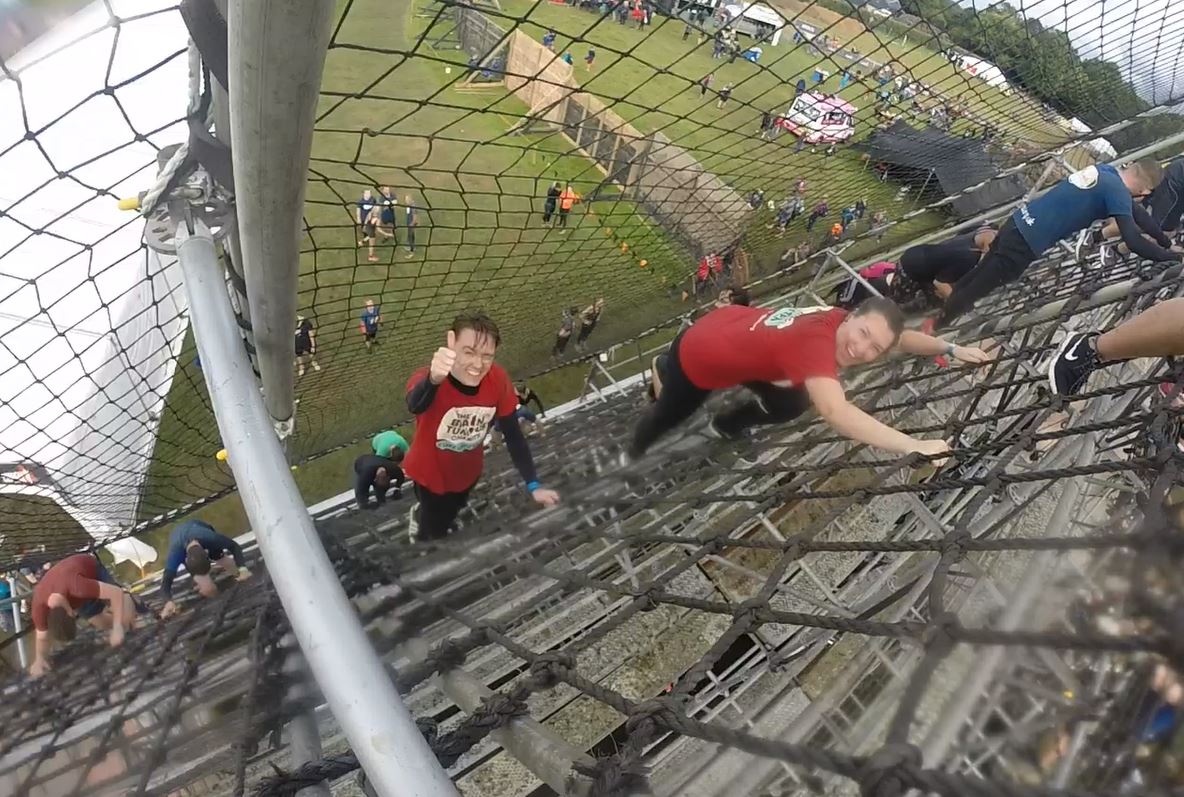 Go Pro photo from tough mudder - climbing a tall rope obstacle