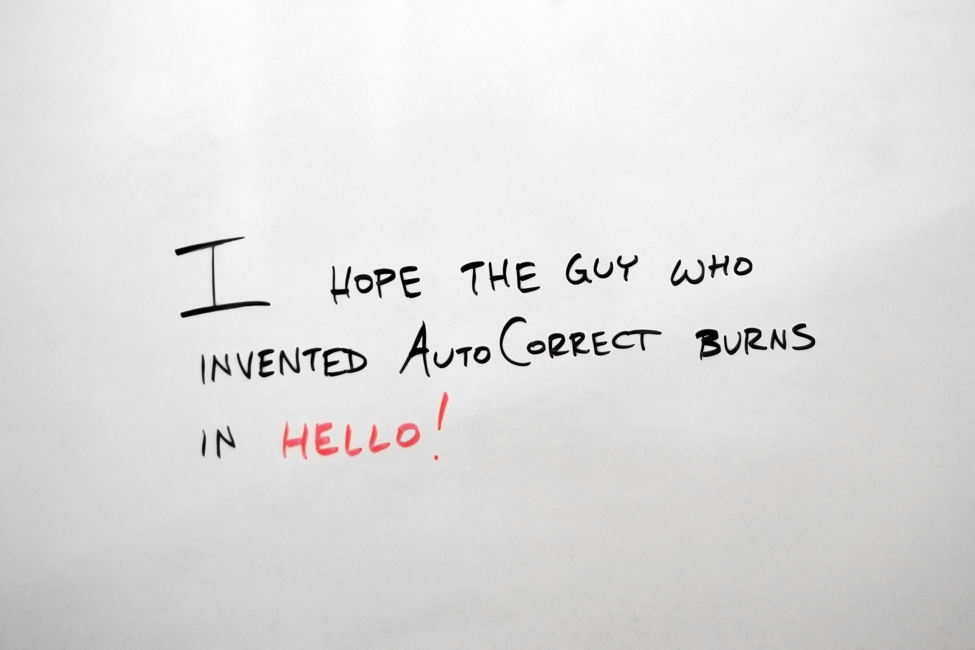 White document with the text I hope the guy who invented auto correct burns in hello!