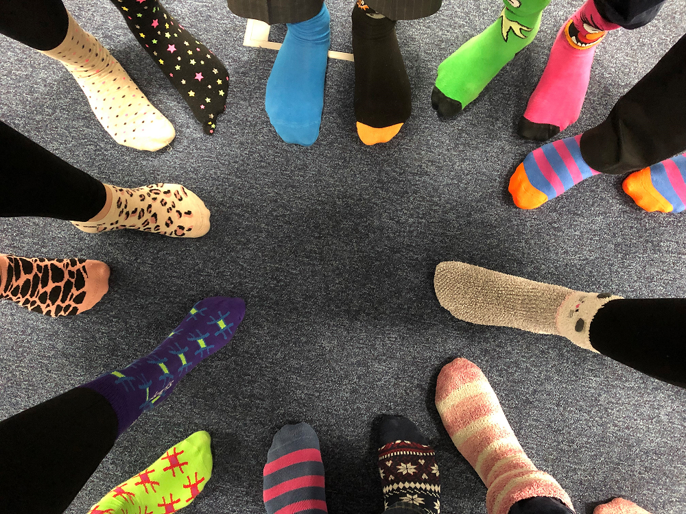 Spectrum IT staff wearing different colou socks