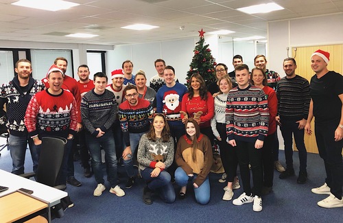 Spectrum IT staff all wearing Christmas jumpers