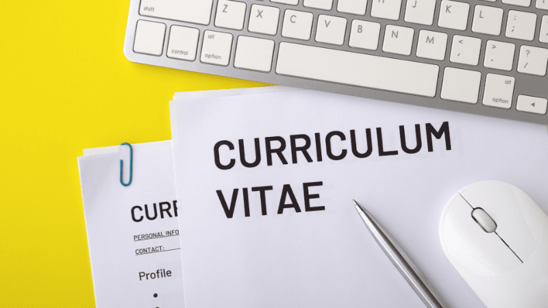 Curriculum Vitae under wireless keyboard and wireless mouse