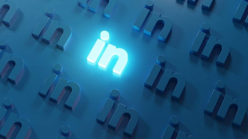 Physical LinkedIn logo lit up with blue light