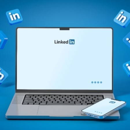 Laptop with LinkedIn homepage surrounded by LinkedIn logos